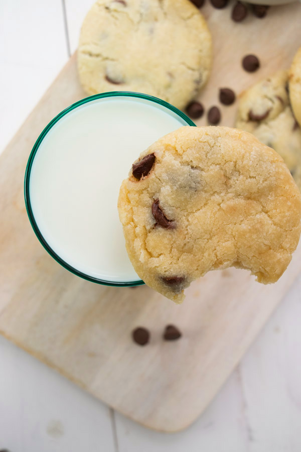 glass of milk with simple chocolate chip cookies