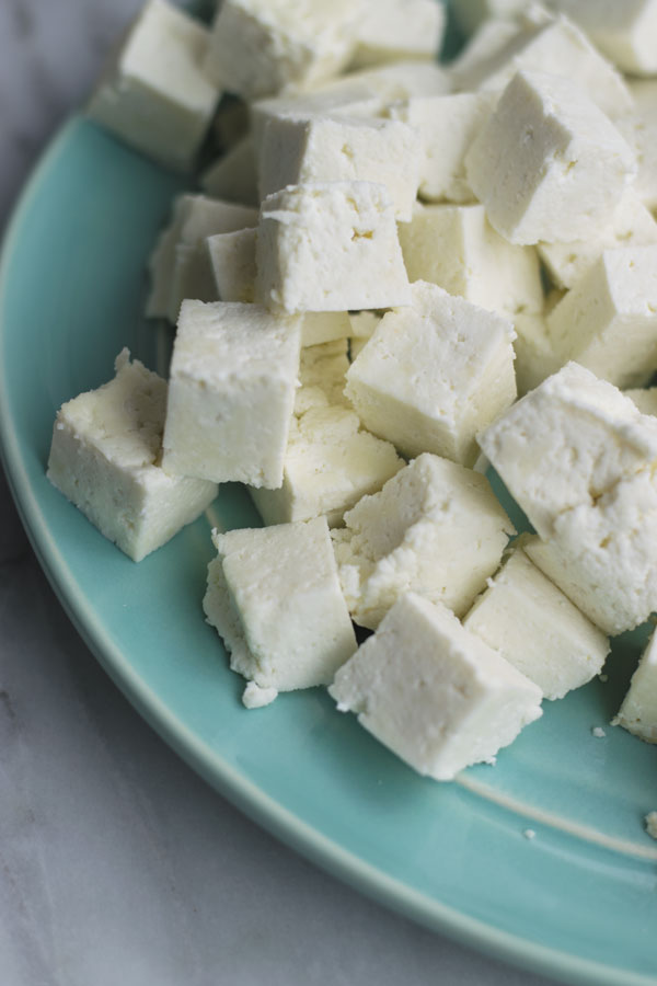 how to make paneer - just 2 ingredients & 30 mins is all you need to make paneer at home! So many delicious ways to eat this cheese! Make easy butter paneer, palak paneer or eat sauteed with salad!