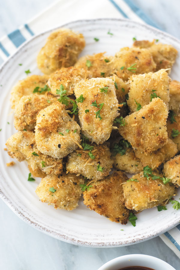 The best Crispy Baked Parmesan Chicken Bites you will ever make at home - extra crispy, tender & BAKED! Just few mins hands on time and dinner ready in a giffy!