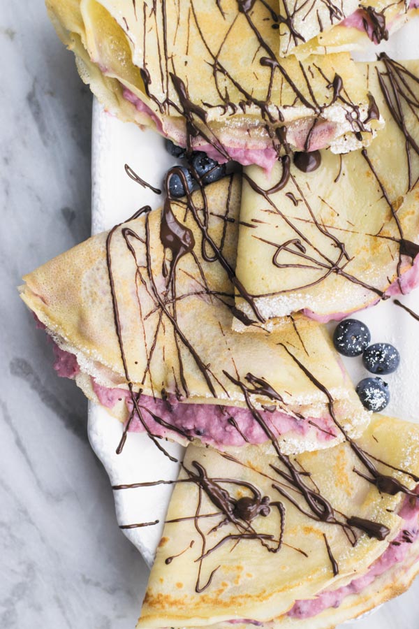 Berry Mascarpone Crepes - delicious from scratch crepes filled with this insanely addicting mixed berries & mascarpone cheese filling. Perfect for holiday morning breakfast or after dinner treat!