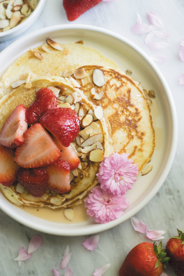 toasted almond strawberry pancakes for eating- Delicious & Easy FROM SCRATCH pancakes with TOASTED ALMONDS & STRAWBERRIES. Can be MAKE AHEAD & stored as well.