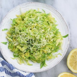 simple easy brussel sprouts salad - a REALLY simple yet ADDICTING crunchy brussel sprouts salad with tangy lemon juice vinaigrette and gruyere!