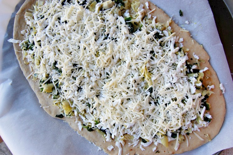 Cheesy Spinach Artichoke Pizza Ready for the Oven