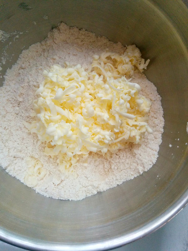 Chilled Butter and Flour to make Cherry Scone Dough.
