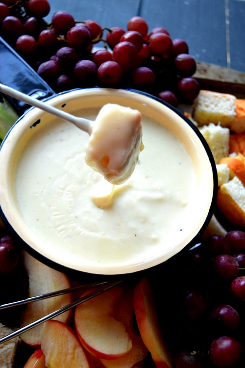 Bread Dipped into 3 Cheese Truffle Oil Fondue