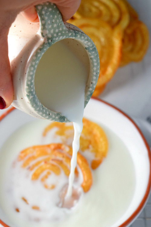 Adding milk to Jalebi (Indian Funnel Cake)