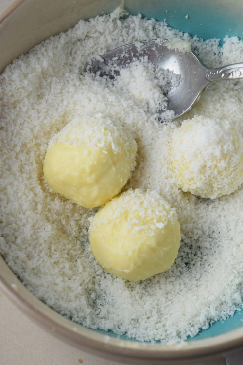 Coconut Being Added to Tropical White Chocolate Truffles