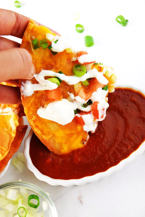 Easy Mexican Pizza Slice Dipped into Sauce