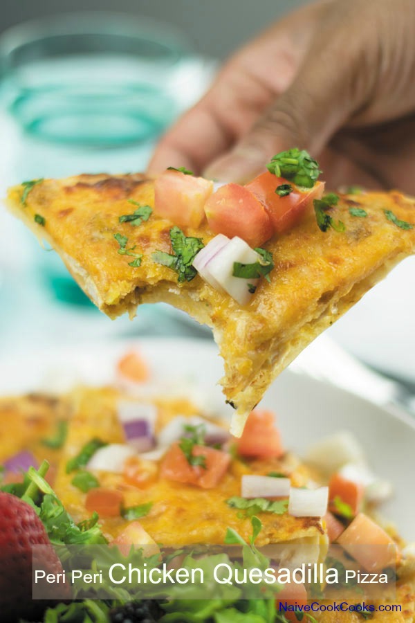 bite from cheesy piri piri chicken quesadilla pizza 1