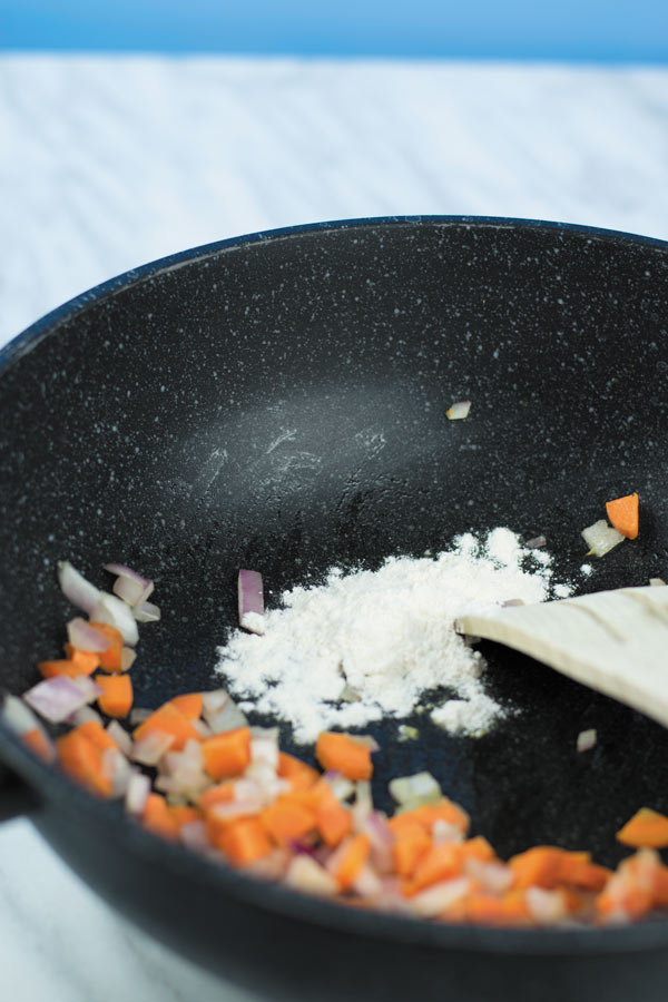 adding flour for cheesy buffalo chicken casserole