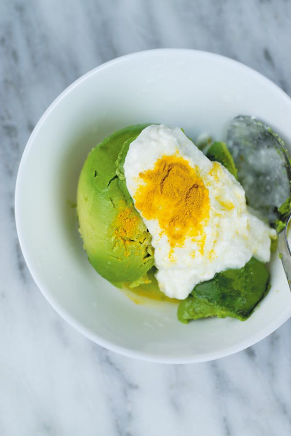 avocado face mask ingredients in a bowl