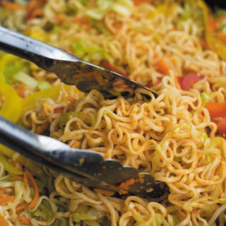 Spicy Schezwan Chowmein Noodles - cheap ramen noodles used without seasoning packets, with tons of fresh vegetables and spicy schezwan sauce. A quick 20 MINS dinner that keeps U & Your wallet full!