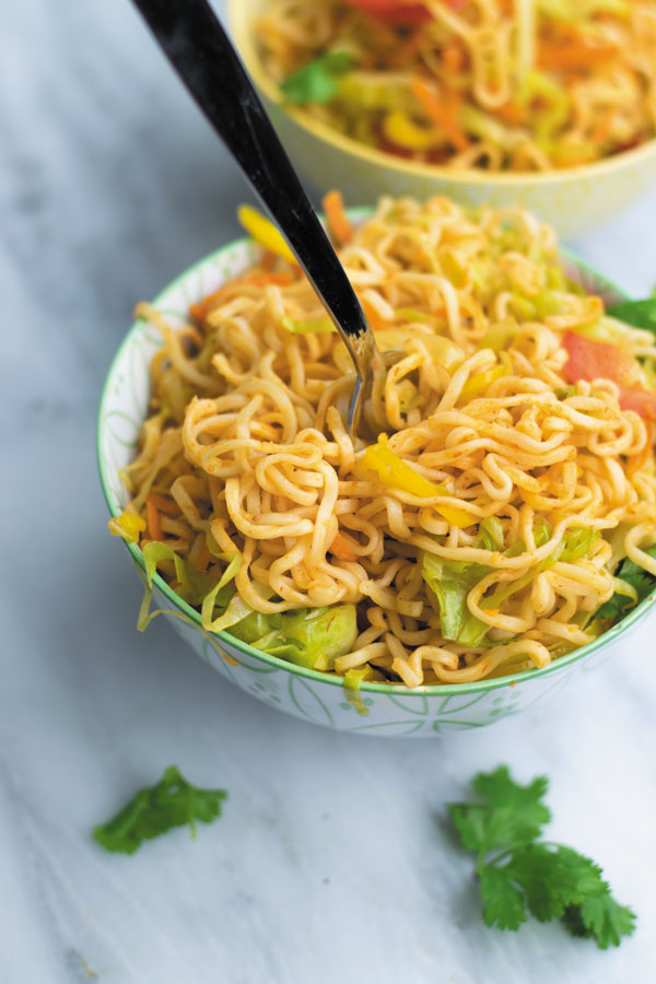 Spicy Schezwan Chowmein Noodles - cheap ramen noodles used without seasoning packets, with tons of fresh vegetables and spicy schezwan sauce. A quick 20 MINS dinner that will make everyone happy! You can even add meat/tofu to make it more filling!