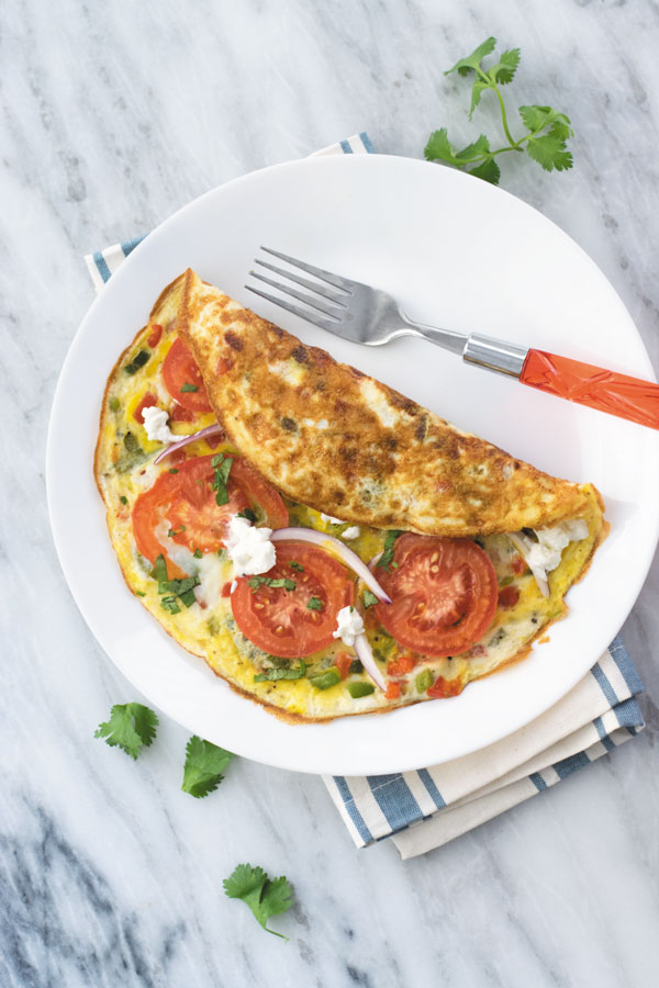 15 mins Veggie Omelette Recipe - a simple out of fridge meal, perfect for breakfast/lunch or dinner. This is one meal I cook when in no mood of cooking! Simple ingredients you will already have in fridge!