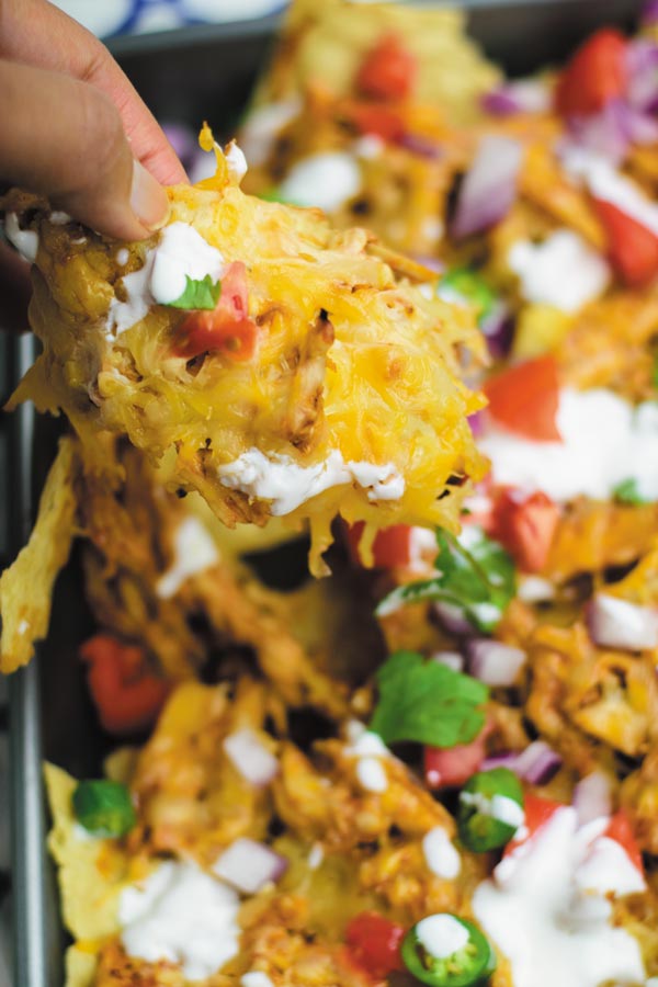 The Best BBQ Chicken Nachos - no need to go to restaurant and pay when you make restaurant quality BBQ chicken nachos at home with fraction of the cost!! And with all the fixins! A MUST for movie nights!