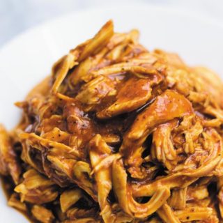 Slow Cooker BBQ Shredded Chicken - just 3 ingredients are all you need to make this delicious BBQ shredded chicken! Great in sandwiches, tacos, burritos or plain! Super flavorful!
