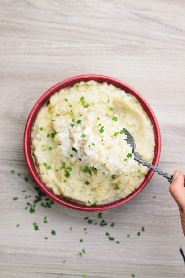 Slow Cooker Garlic Mashed Potatoes - make holiday time easier by making everyone's favorite mashed potatoes in SLOW COOKER! No boiling needed! Just throw everything in slow cooker and just stir once done!