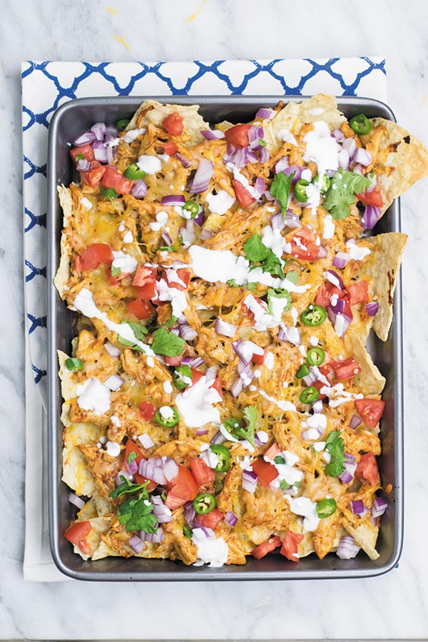 The Best BBQ Chicken Nachos - no need to go to restaurant and pay when you make restaurant quality BBQ chicken nachos at home with fraction of the cost!! And with all the fixins! A MUST for movie nights!