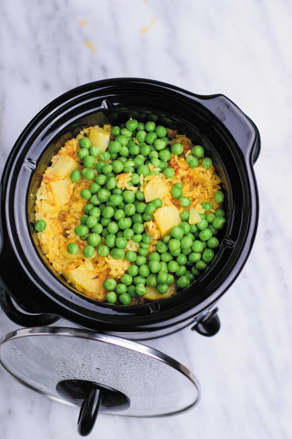 slow cooker spiced vegetable rice - delicious eaten plain or served as a side, this one pot meal comes together in slow cooker! Spiced rice with peas and potatoes makes for a meal loved by all! Leftovers are great for next day lunch with grilled chicken or eaten plain with yogurt & pickle!
