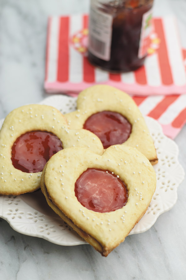 Coconut & jam heart cookies - Coconut cookies with strawberry jam sandwiched in between. So good, just few ingredients and ready in under an hour!