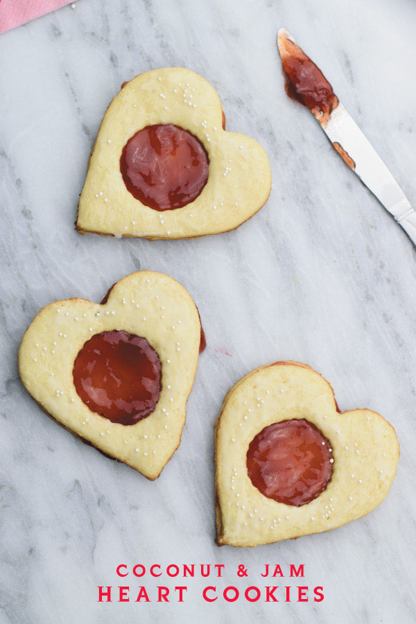 Coconut & jam heart cookies - Coconut cookies with strawberry jam sandwiched in between. Perfect valentines day treat or anytime snack!