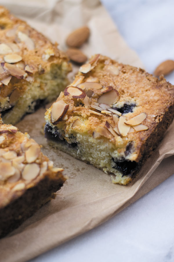 Slice of almond blueberry snacking cake