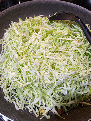 Cabbage & Peanut Stir Fry steps cabbage in pan