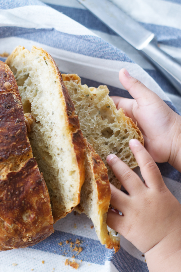 roasted garlic and rosemary no knead bread sliced for eating